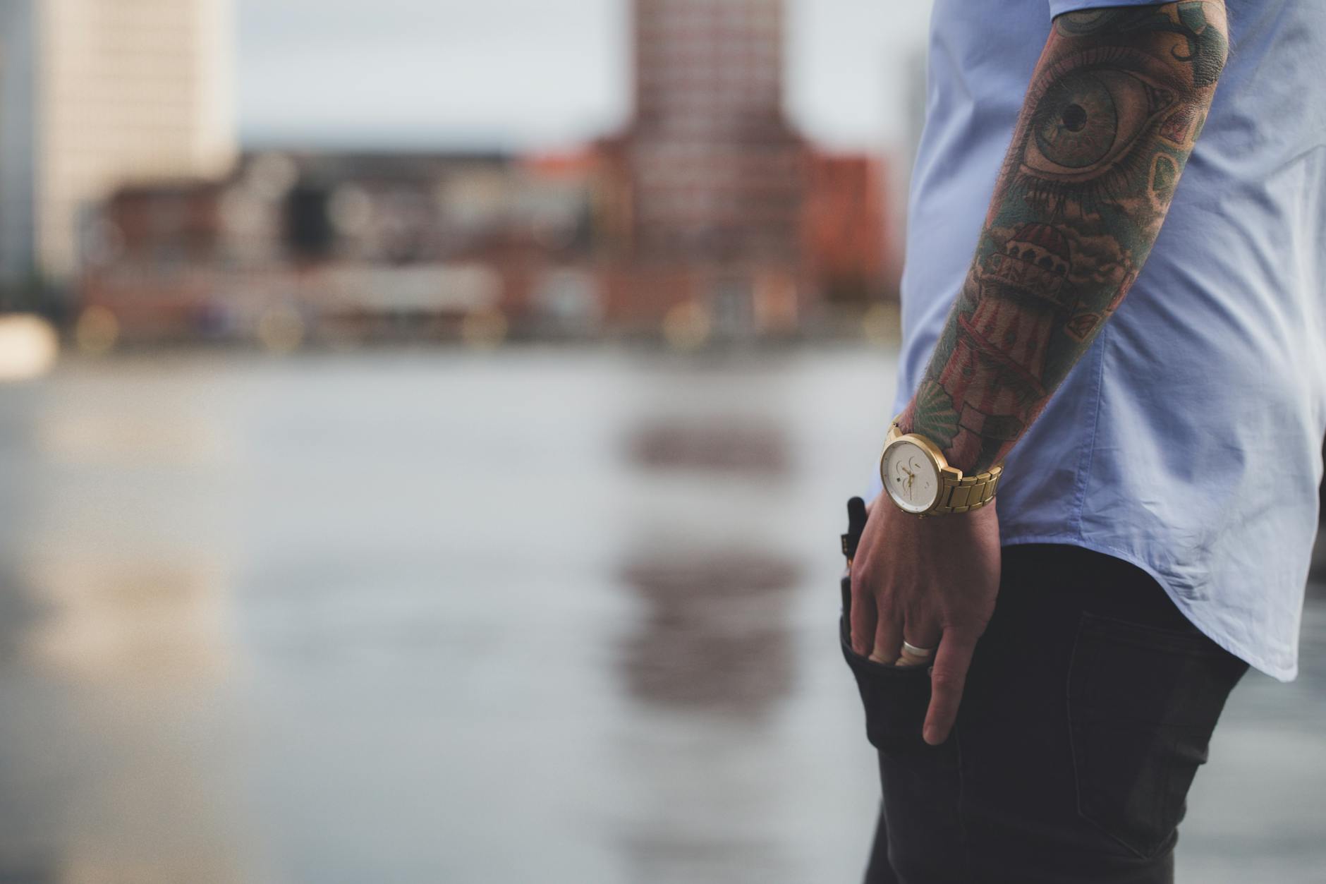 selective focus photography of man wearing blue shirt