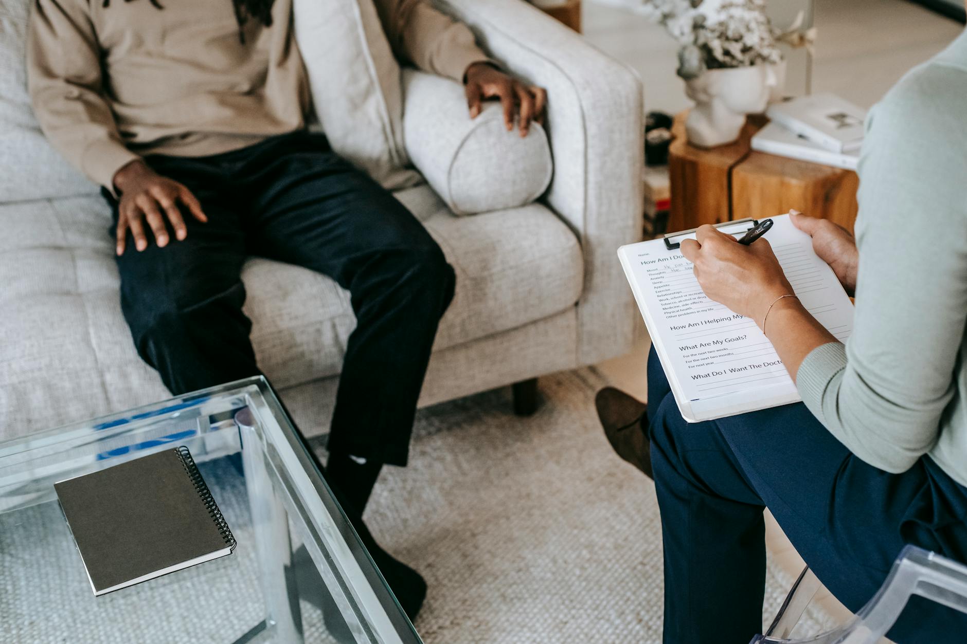 crop unrecognizable black man sharing complains with female psychologist